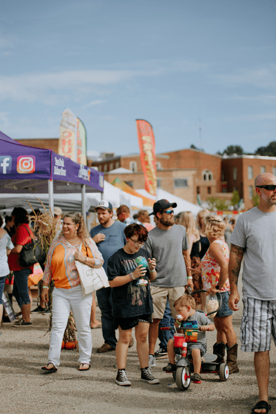 A family in a crowd at the Garlic Festival.