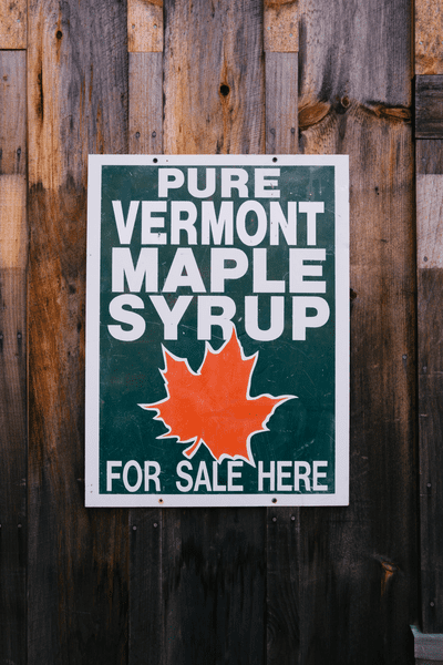 A sign that reads Pure Vermont Maple Syrup For Sale Here.