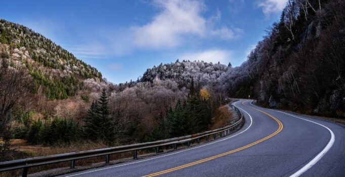 Scenic drives include the winding road of the App Gap stretches out on a sunny day with frosted trees and hills all around.