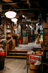 The inside of a general store in Vermont with wooden floors and goods on the shelves.