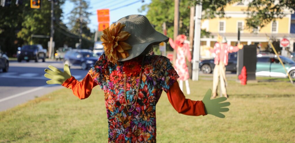 Festive autumn scarecrows dressed as 