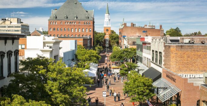 Seen from above, a bustling outdoor shopping street in the summer.