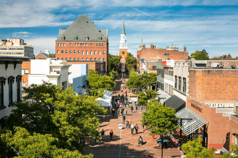 Seen from above, a bustling outdoor shopping street in the summer.
