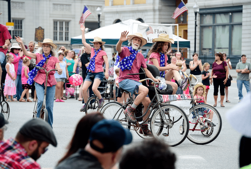 Cyclists ride in a parade.