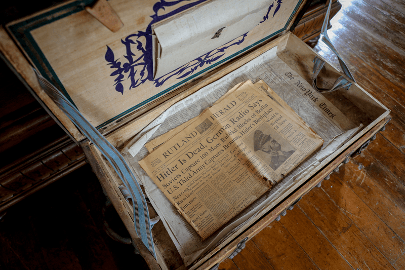 An old newspaper clipping rests within a trunk inside the Wilson Castle.