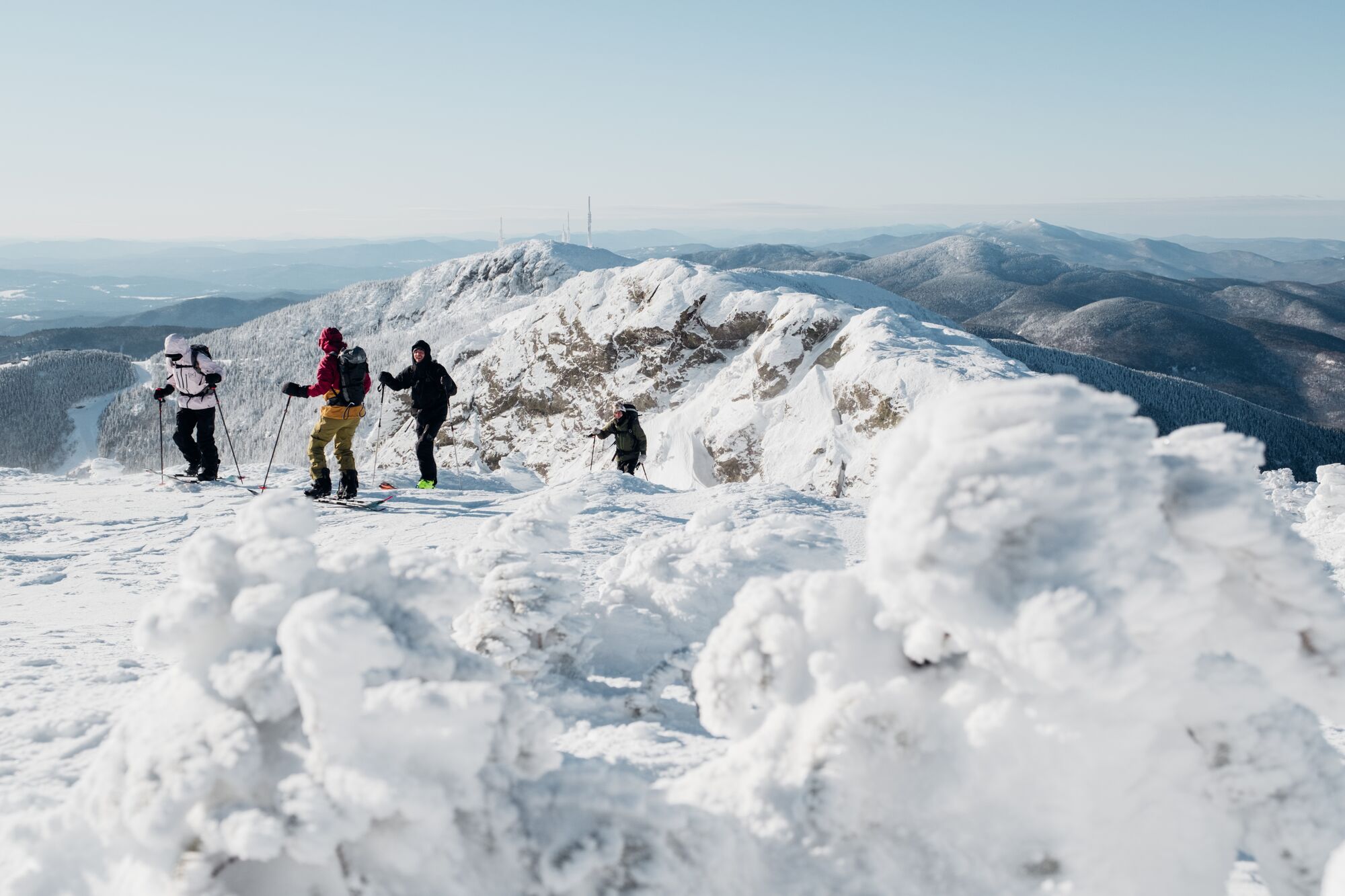 Hikers climb a snow covered trail in Vermont.
