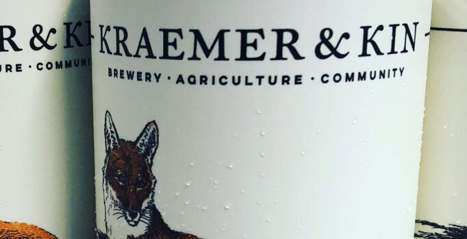 Close view of a beer can label reading "Kraemer & Kin Brewery | Agriculture | Community"
