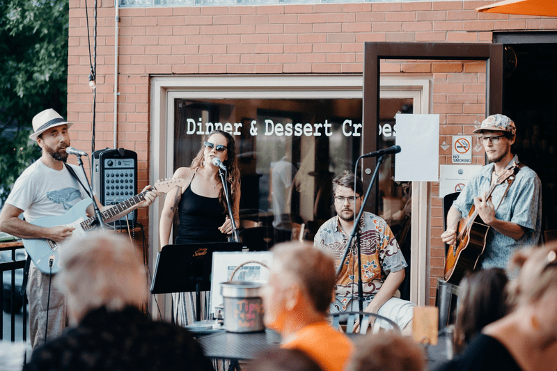 A live band plays in front of a business in Montpelier, Vermont.