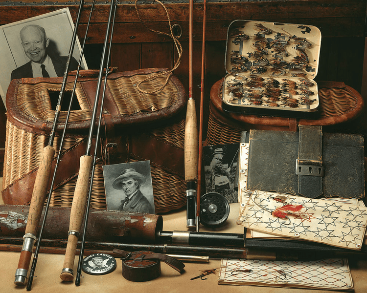Fishing supplies laid out on a wooden bench.