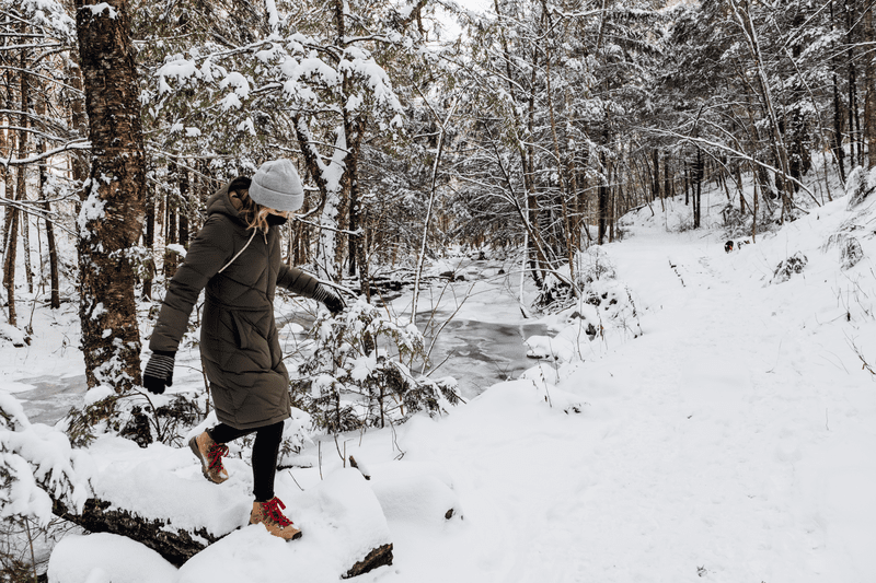 A person explores Little River State Park after fresh snowfall.