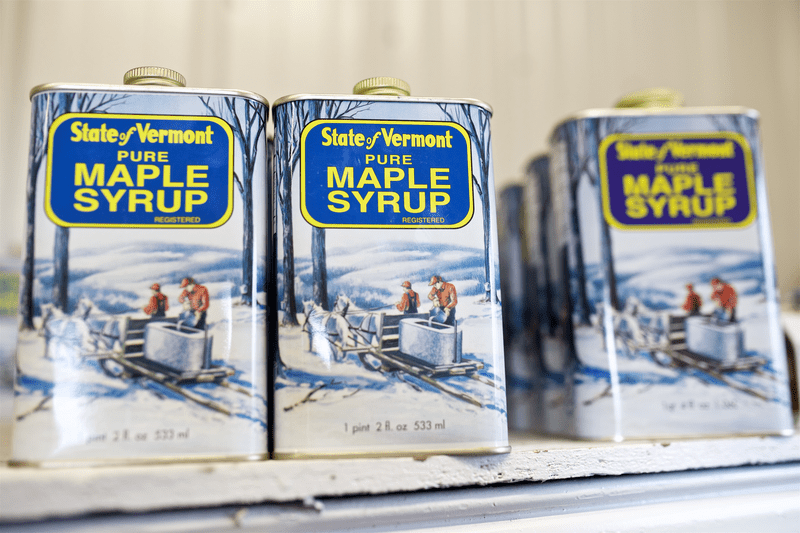 Cans of Pure Vermont Maple Syrup.