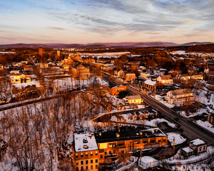 Aerial view of Vergennes, Vermont during winter golden hour.