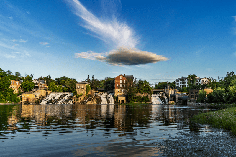 Striking image of a cloud hovering over Vergennes Falls Park during summer.