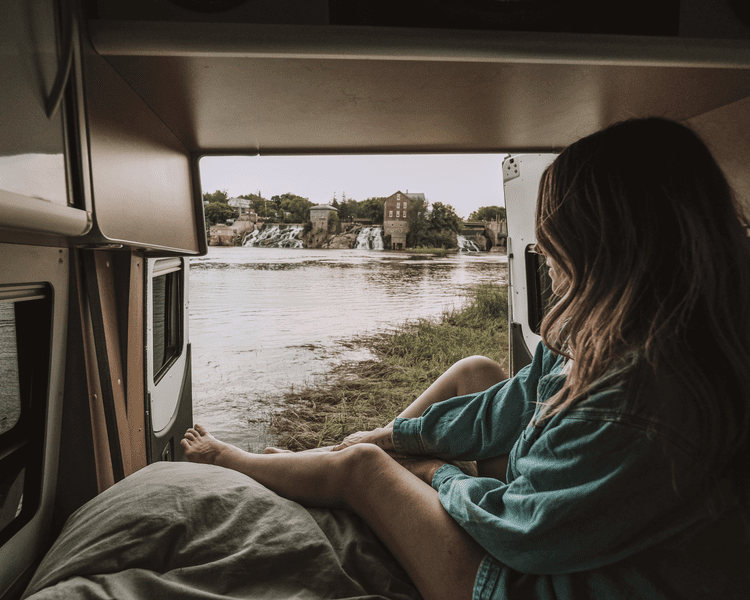 Overlooking Vergennes Falls Park from the interior of a camper van.