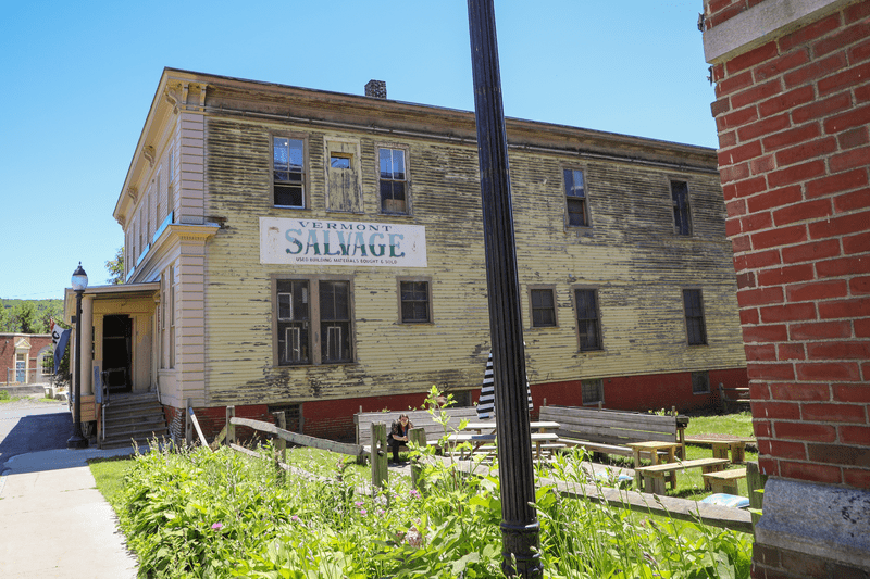 Vermont Salvage signage on the side of a building in White River Junction, Vermont.