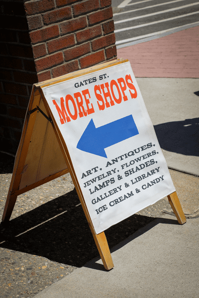 An A-Frame sign on Gates Street points to more shops in White River Junction, Vermont.