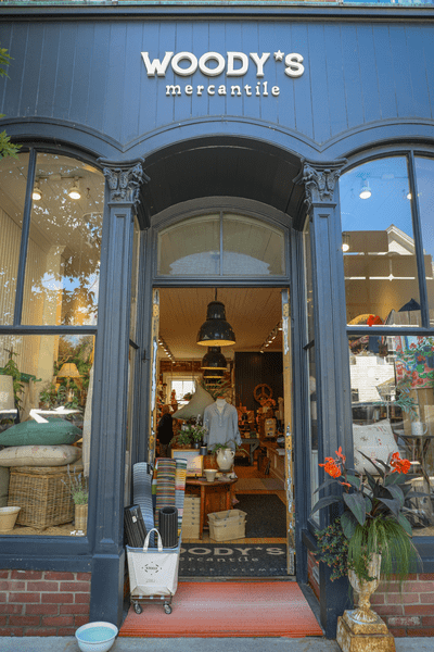 The exterior storefront of Woody's Mercantile.