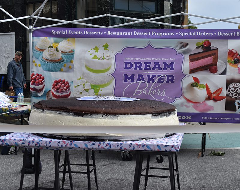 A large whoopie pie on a table outside.