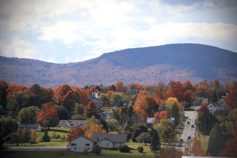 Seen from afar, a rural mountain town in the fall.