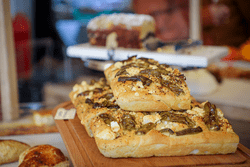 Baked goods are on display in a bakery.