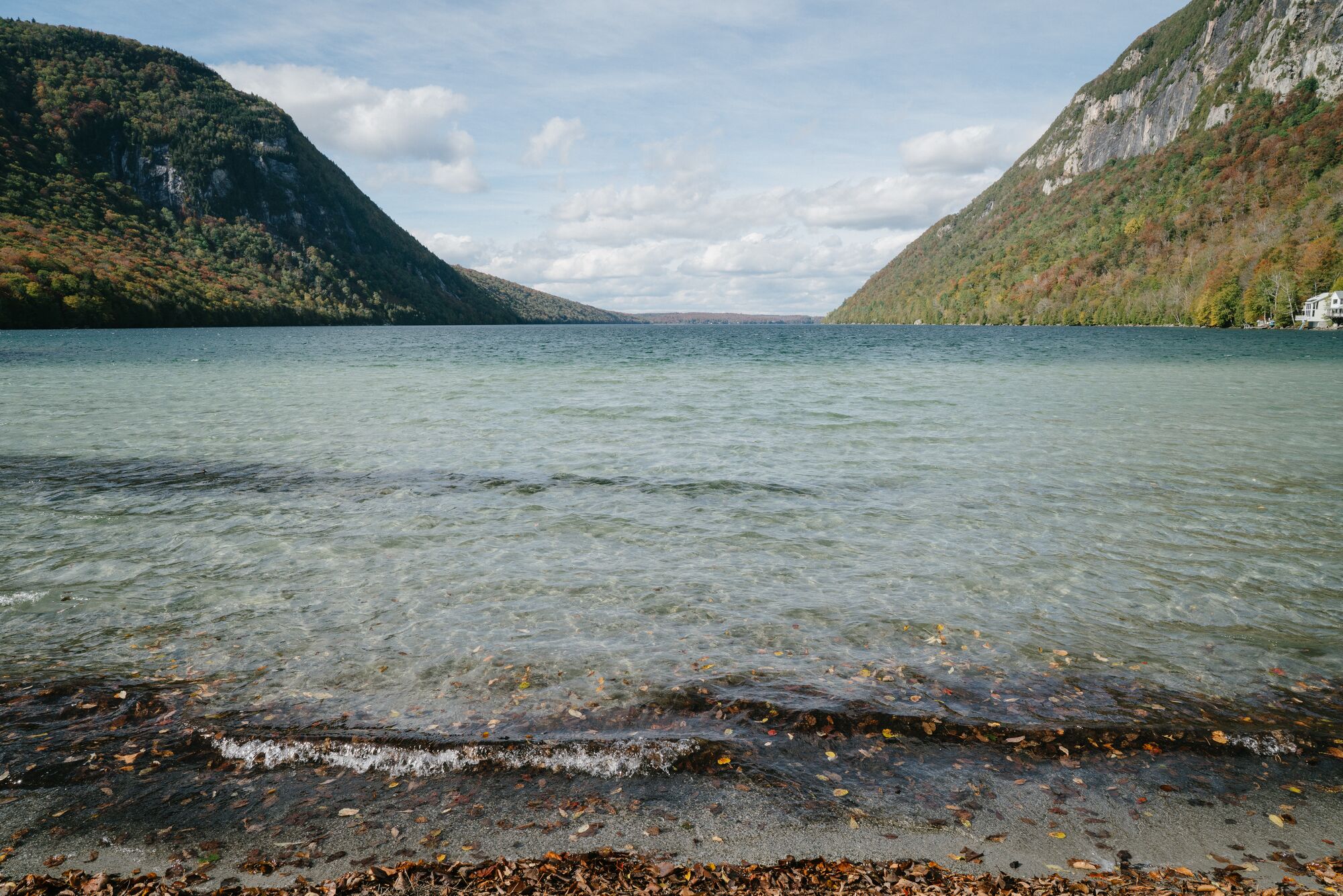 A lake with two mountains visible behind