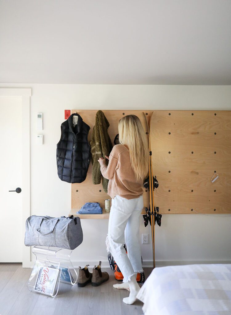 A person with a few small bags around them, having packed for a trip.