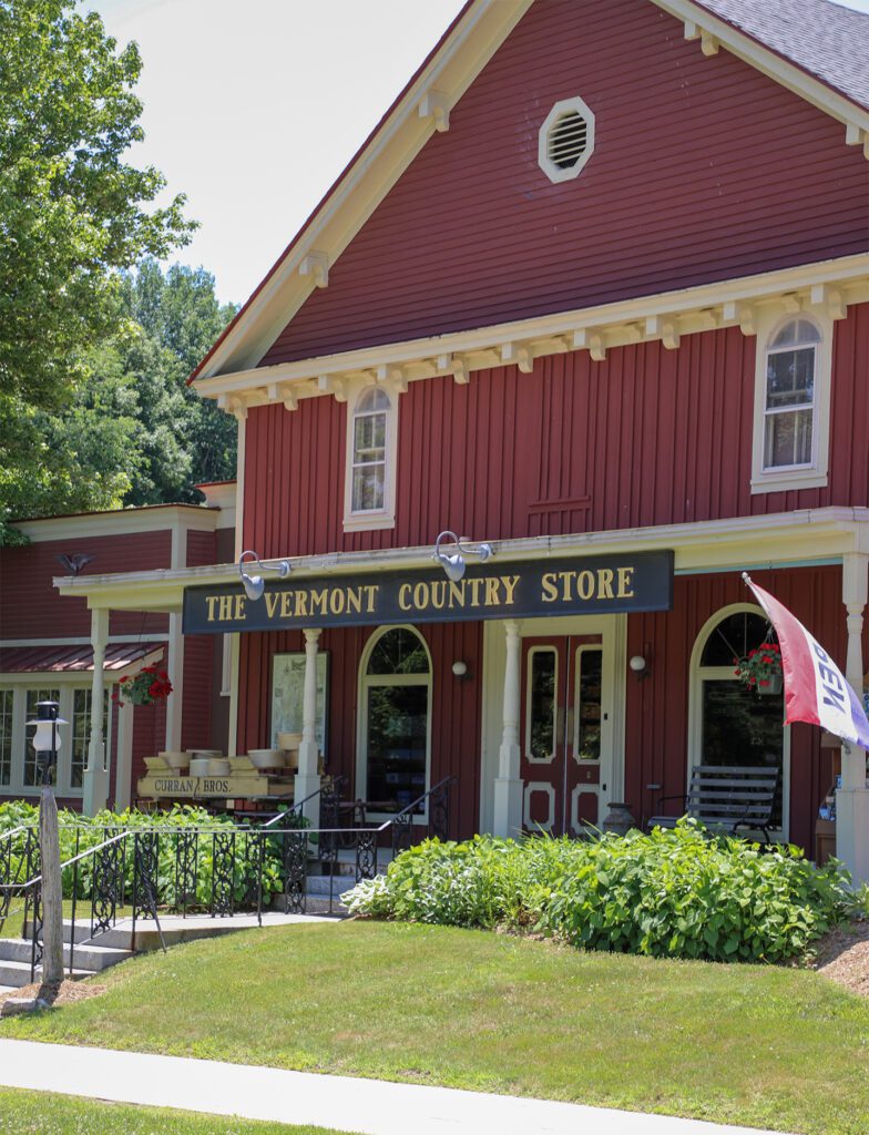 A red building with a sign on it that reads The Vermont Country Store.