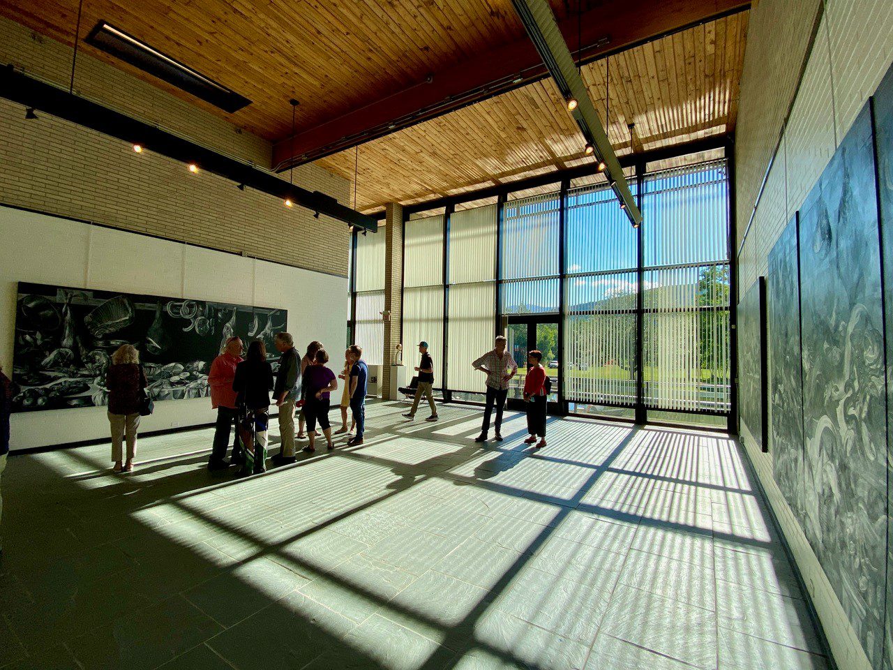 A modern art gallery with large windows in Vermont.