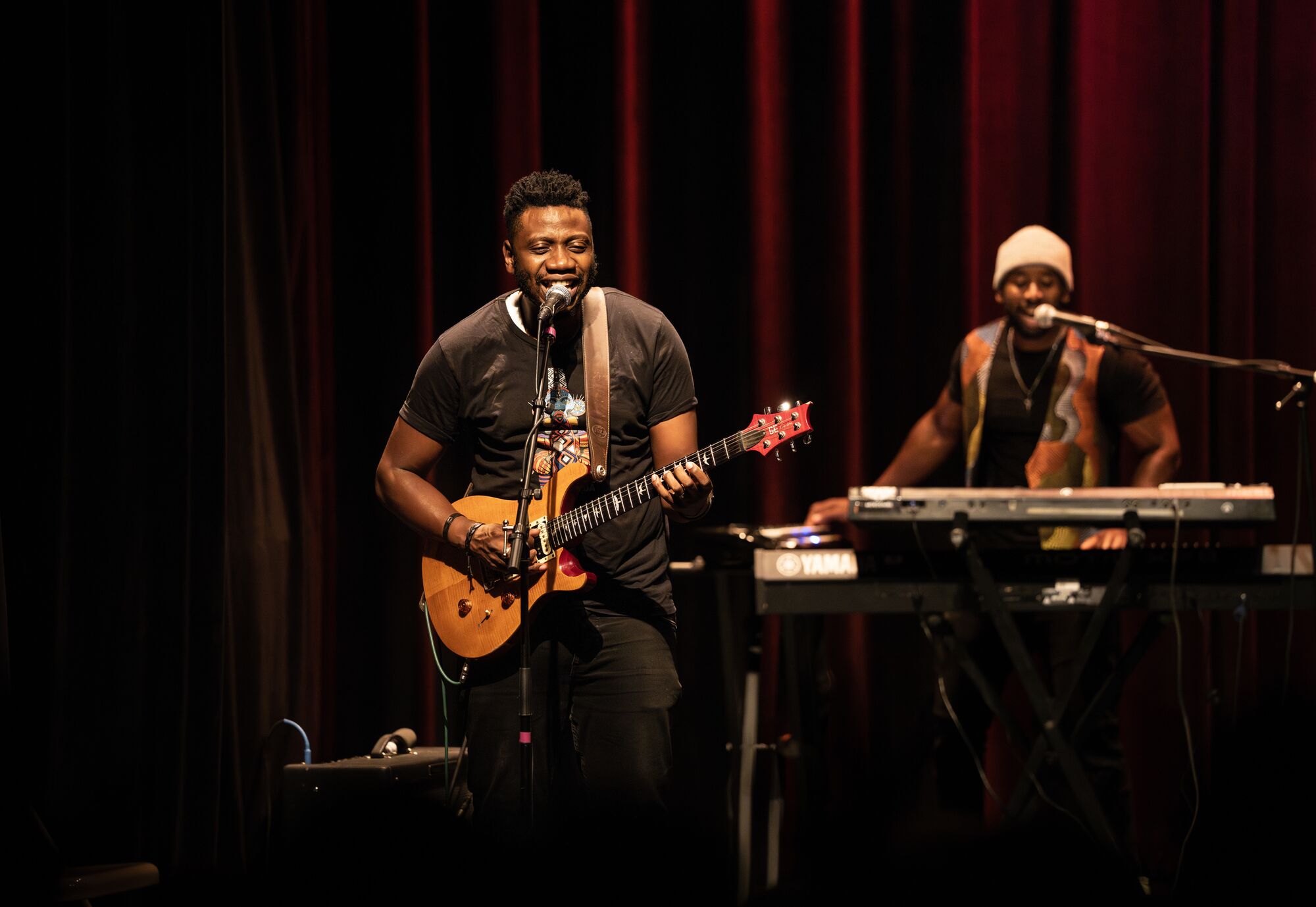 Two musicians play onstage in Vermont.