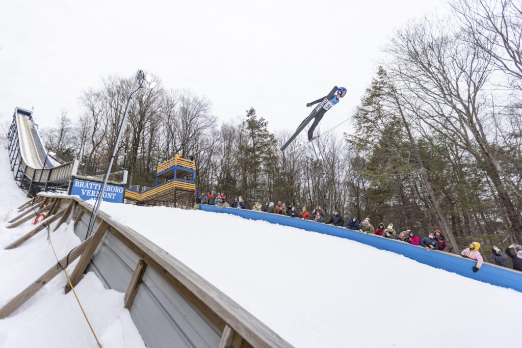 A skier jumping off a ramp in Vermont.
