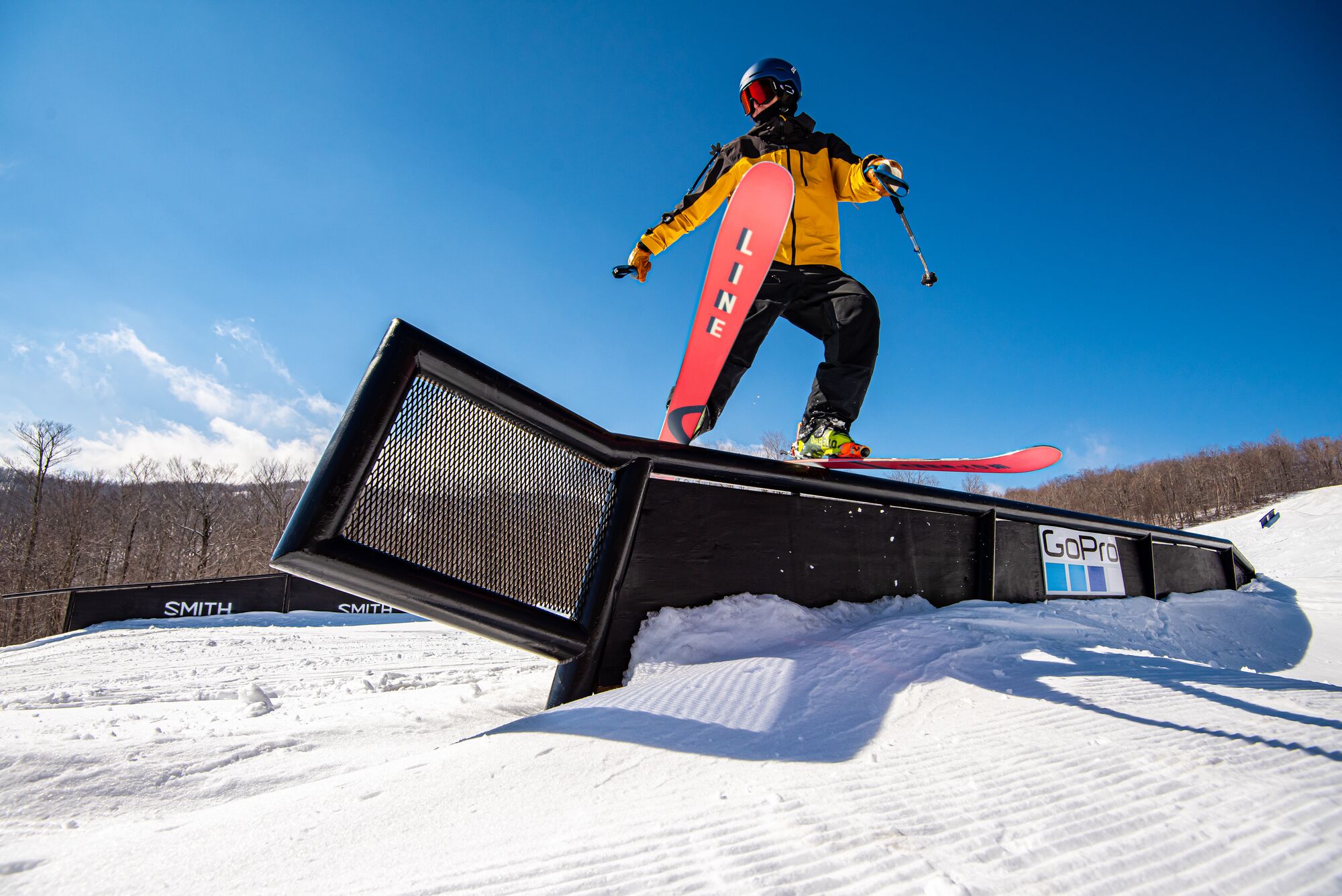 A skier does a trick on a rail obstacle in Vermont.