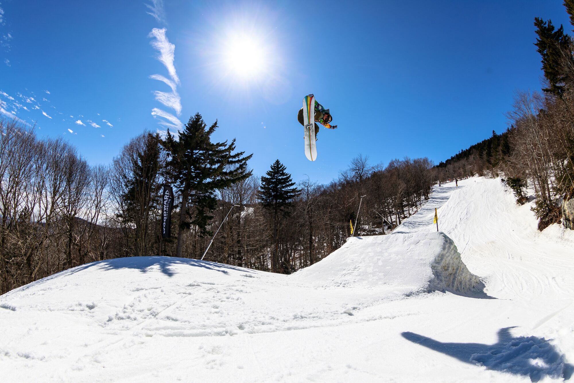 A snowboarder flies through the air in Vermont.