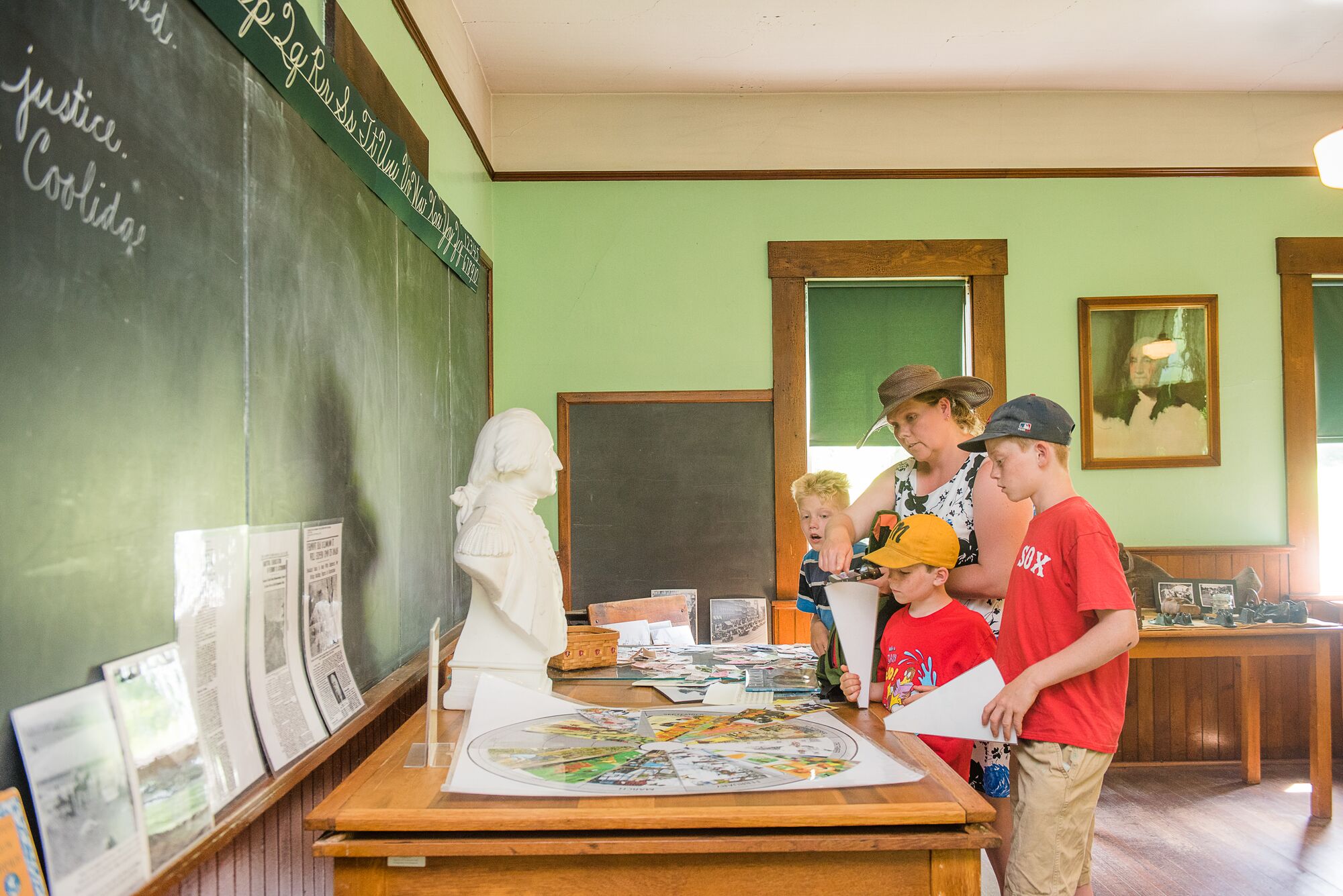 Children visit an old-fashioned classroom in Vermont.