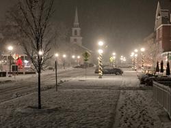 A snowy night in a small downtown in Vermont.