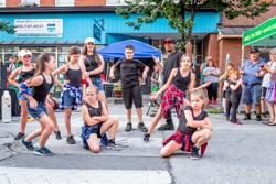 Children dance at a street fair in Vermont.