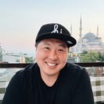 A smiling man in a hat.