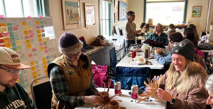 A group of people participate in an educational activity.